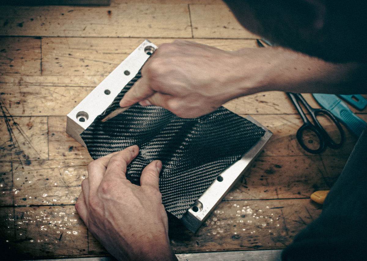 a carbon fiber part being put into a mold