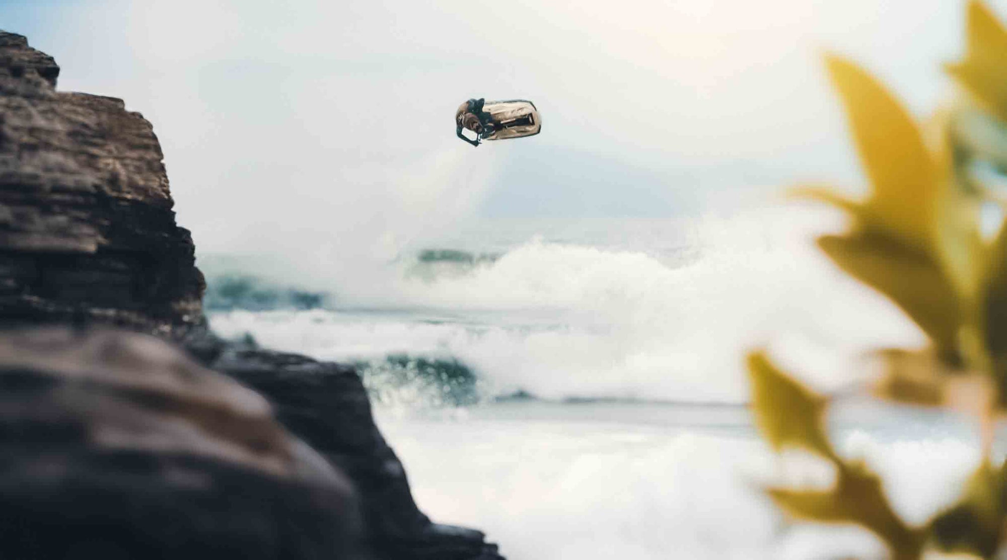 a guy jumping on a jetski